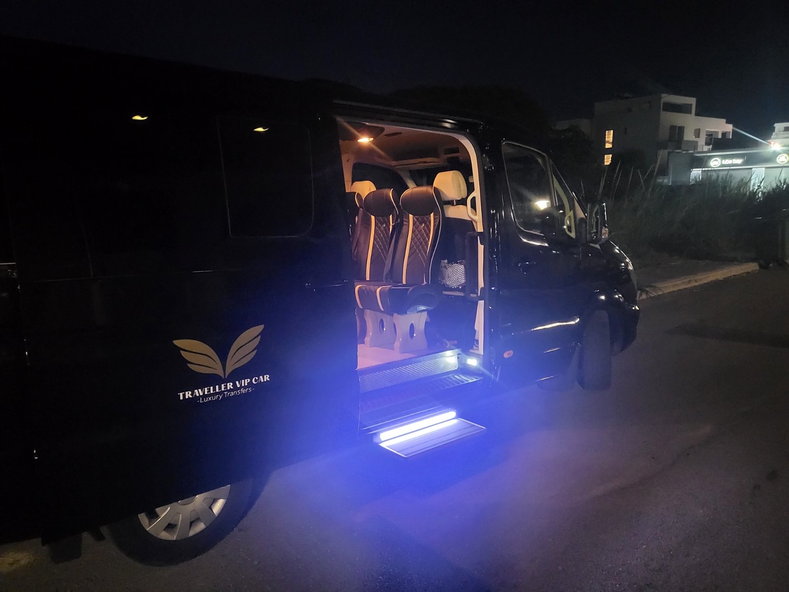Black Mercedes-Benz Sprinter parked at night on Kos